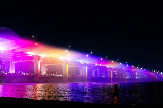 Colorful lights across a live event at night
