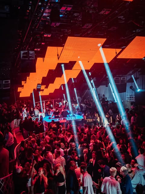 Live event with beams of light over a crowd